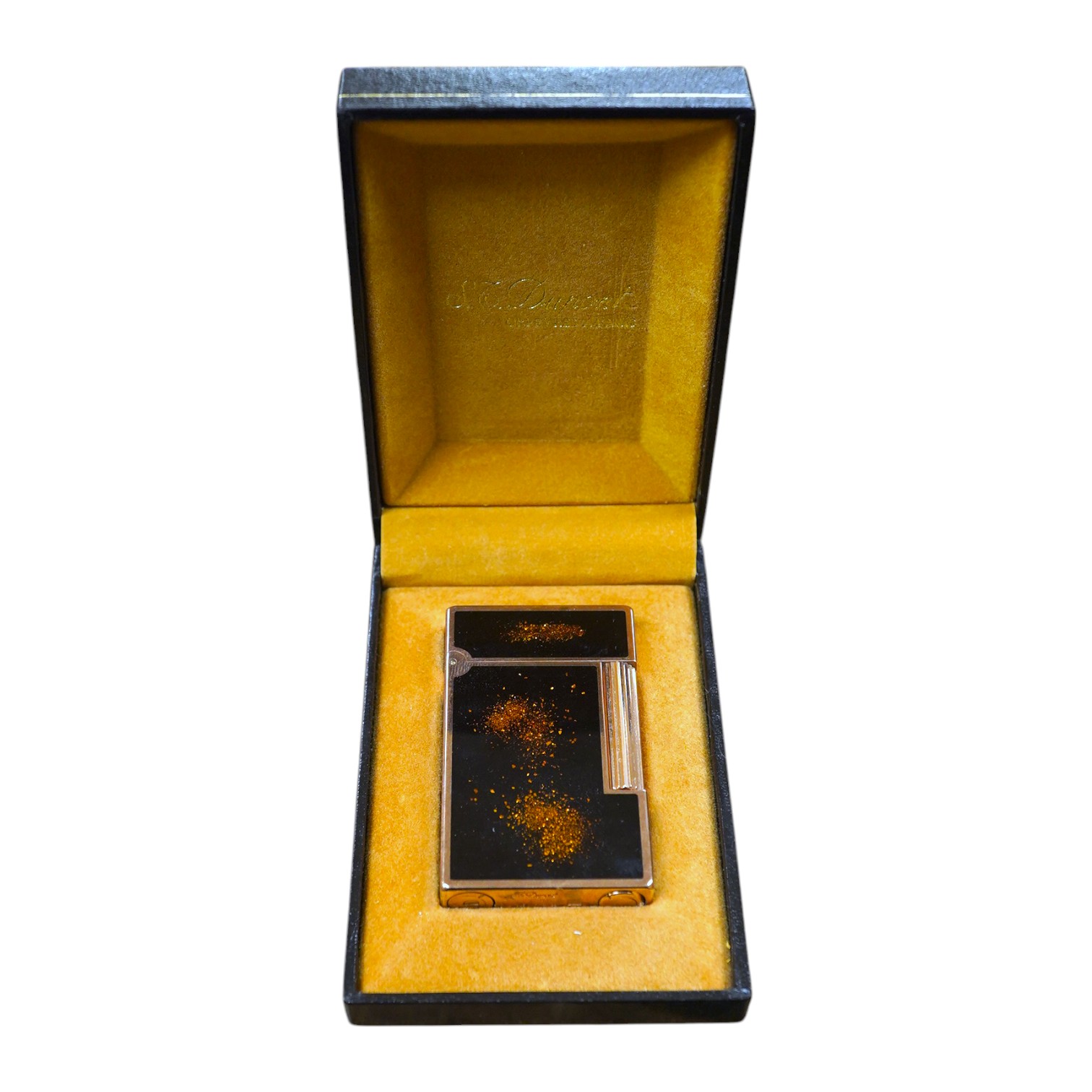 A cased Dupont 'gold dust' lighter with booklet. Condition - good